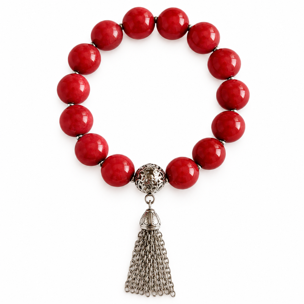 Colours of Fabulous Cayenne Tassel Bracelet with red beads and silver chain tassel on white background