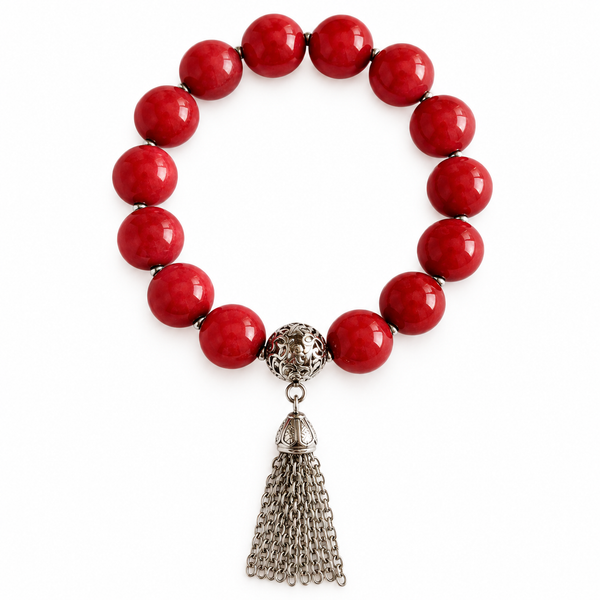 Colours of Fabulous Cayenne Tassel Bracelet with red beads and silver chain tassel on white background