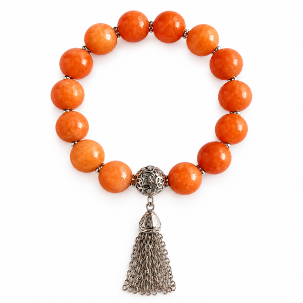 Colours of Fabulous Celosia Orange Tassel Bracelet on white background