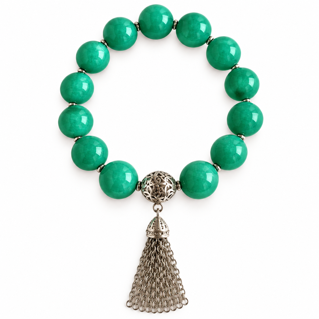 Colours of Fabulous Comfrey Tassel Bracelet green beads silver chain tassel white background