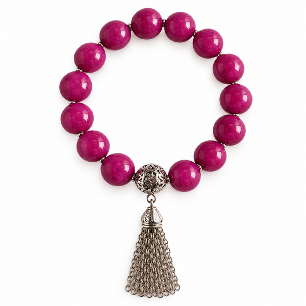 Colours of Fabulous Magenta Purple Tassel Bracelet on white background with fine silver spacers and chain tassel