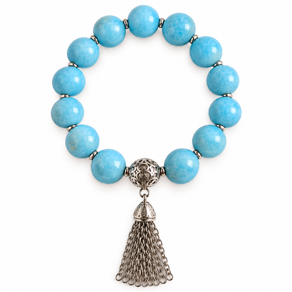 Colours of Fabulous Placid Blue Tassel Bracelet soft blue beads and silver chain tassel on white background