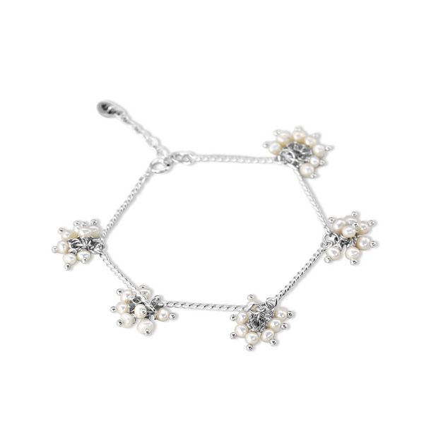 bunches of seed pearls hanging on a sterling silver chain bracelet with bar features, seed pearl bracelet, white seed pearls, white seed pearl bracelet, seed pearl bunch bracelet, unique bracelet, sterling silver bracelet, womens jewellry, unique womens jewellery, jewellery designed in new zealand, new zealand designer, womens fashion, beautiful jewellery, high quality jewellery, auckldn designer jewellery, new zealand designer jewellery